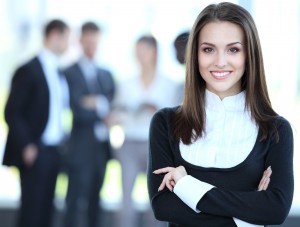 Face of beautiful woman on the background of business people