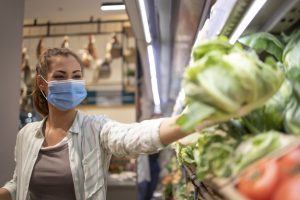 woman-with-hygienic-mask-rubber-gloves-shopping-cart-grocery-buying-vegetables-during-corona-virus-preparing-pandemic-quarantine_342744-496